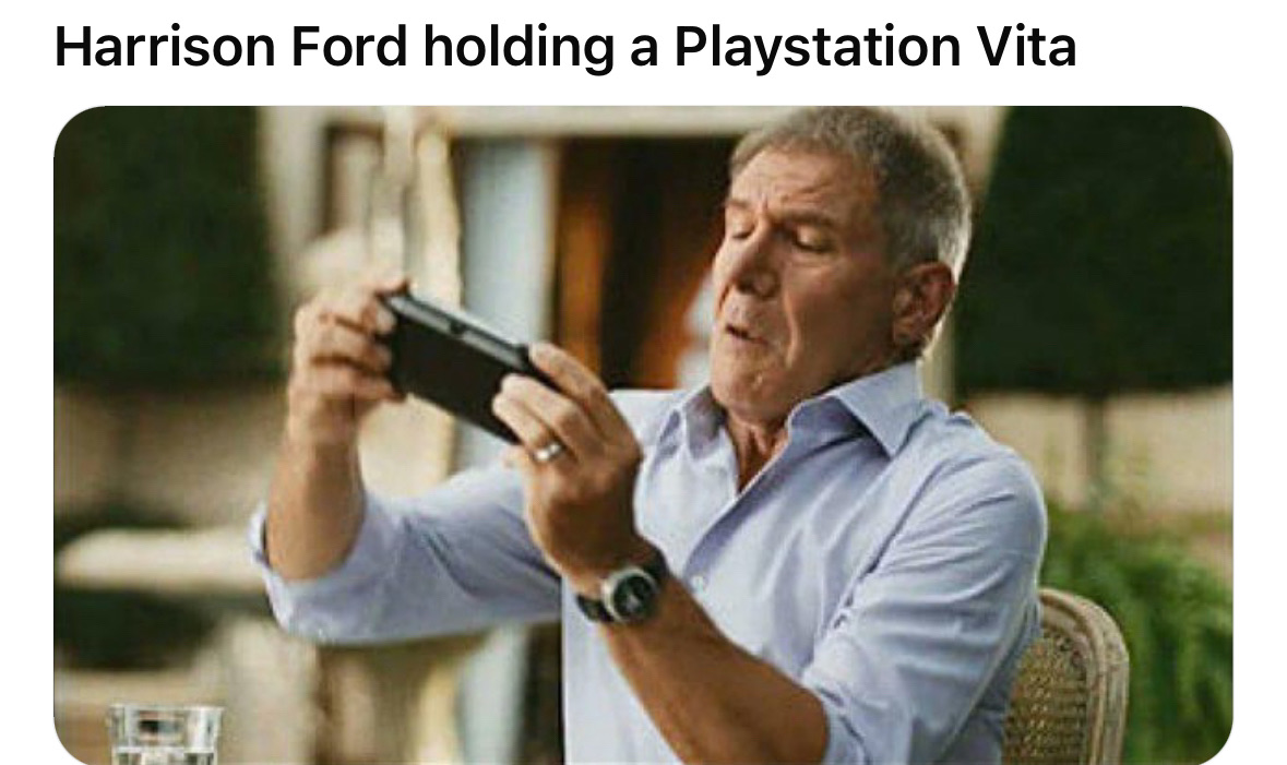 Harrison Ford holding a Playstation Vita